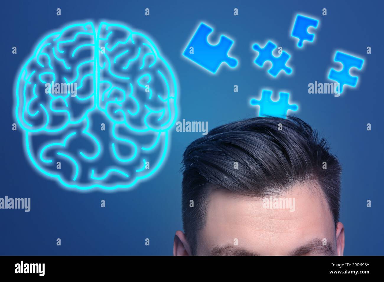 Speicher. Mann, Puzzleteile und Neongehirn auf blauem Hintergrund Stockfoto