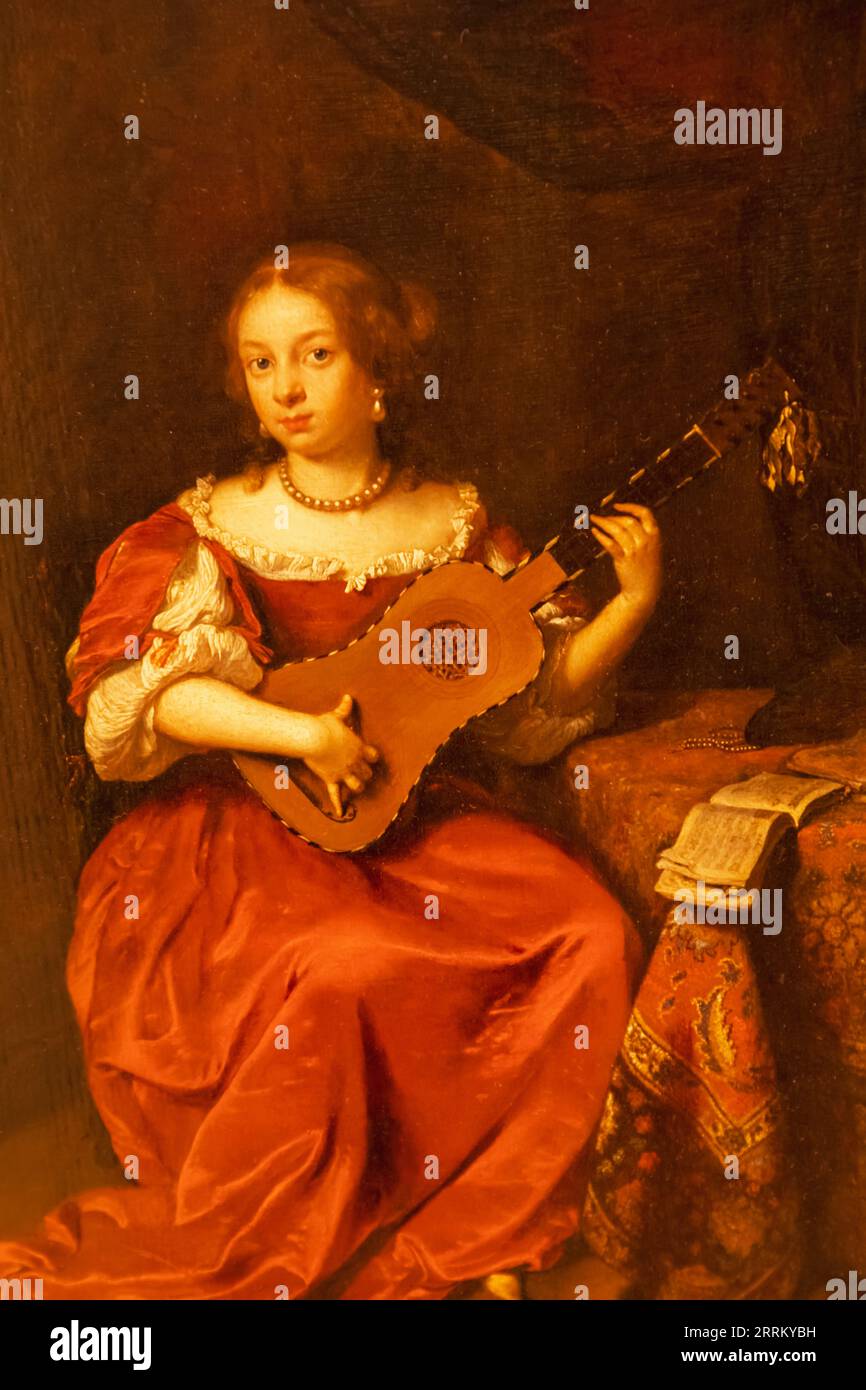 England, London, Heartford House, The Wallace Collection Museum, Painting mit dem Titel „A Lady playing the Guitar“ von Caspar Netscher aus dem Jahr 1669 Stockfoto