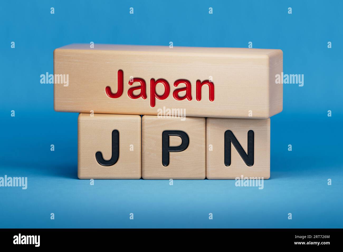 Japan und JPN-Symbol. Konzeptworte Japan und JPN auf Holzblöcken. Englische Bezeichnung und Abkürzung des Ländernamens. Kopieren Sie Space.3D-Rendering auf Blue BA Stockfoto