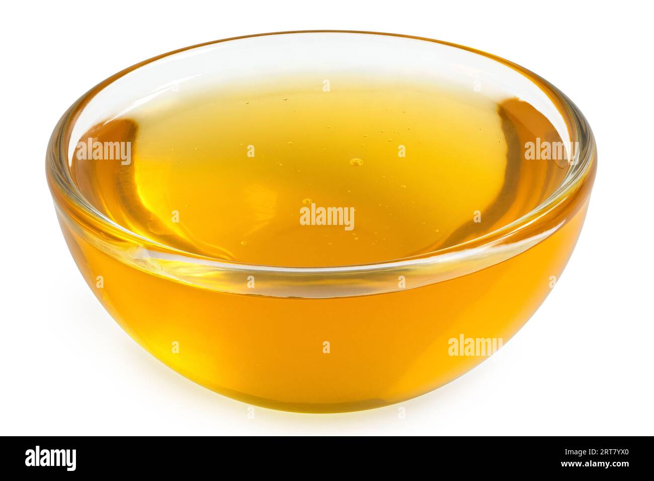 Honig in einer Glasschale isoliert auf weiß. Stockfoto