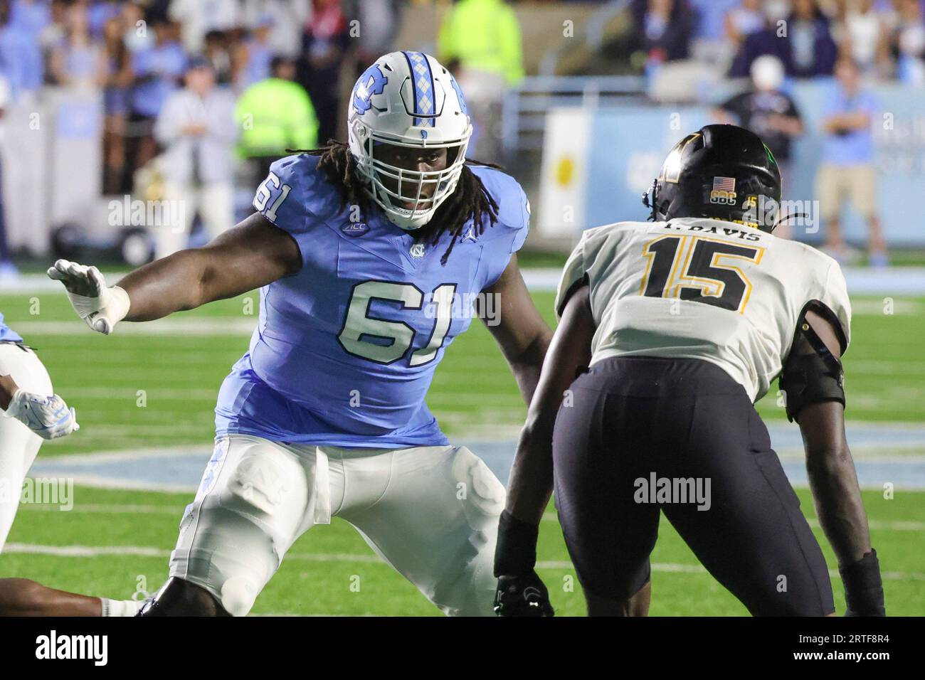 North Carolina offensive lineman Diego Pounds (61) guards against Appalachian State linebacker Thomas Davis (15) during the second overtime of an NCAA college football game, Saturday, Sept. 9, 2023, in Chapel Hill, N.C. (AP Photo/Reinhold Matay) Stockfoto