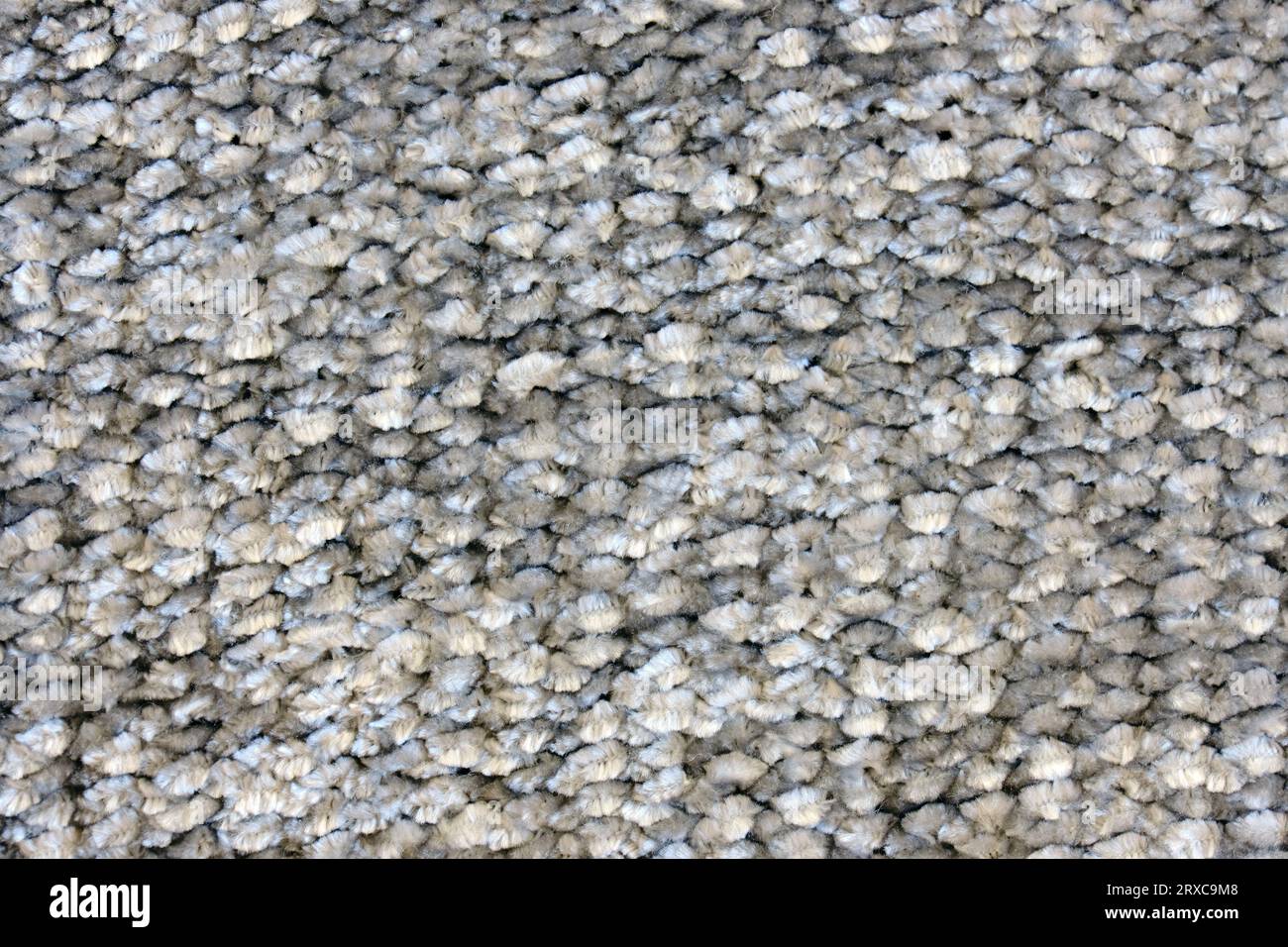 Nahaufnahme der Oberfläche eines grauen Wollteppichs. Foto mit hoher Auflösung. Stockfoto