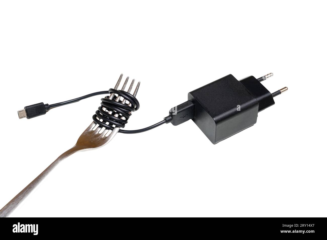 Ein elektrisches Kabel um eine Gabel gewickelt Stockfoto