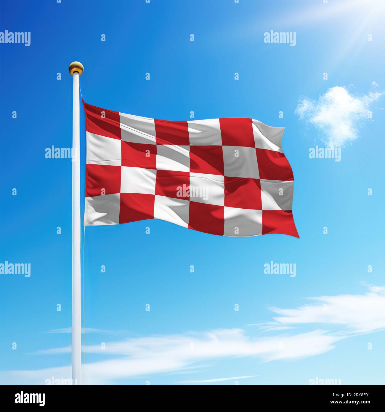 Die winkende Flagge von Nord-Brabant ist ein niederländischer Bundesstaat auf einem Fahnenmast mit Himmelshintergrund. Stockfoto