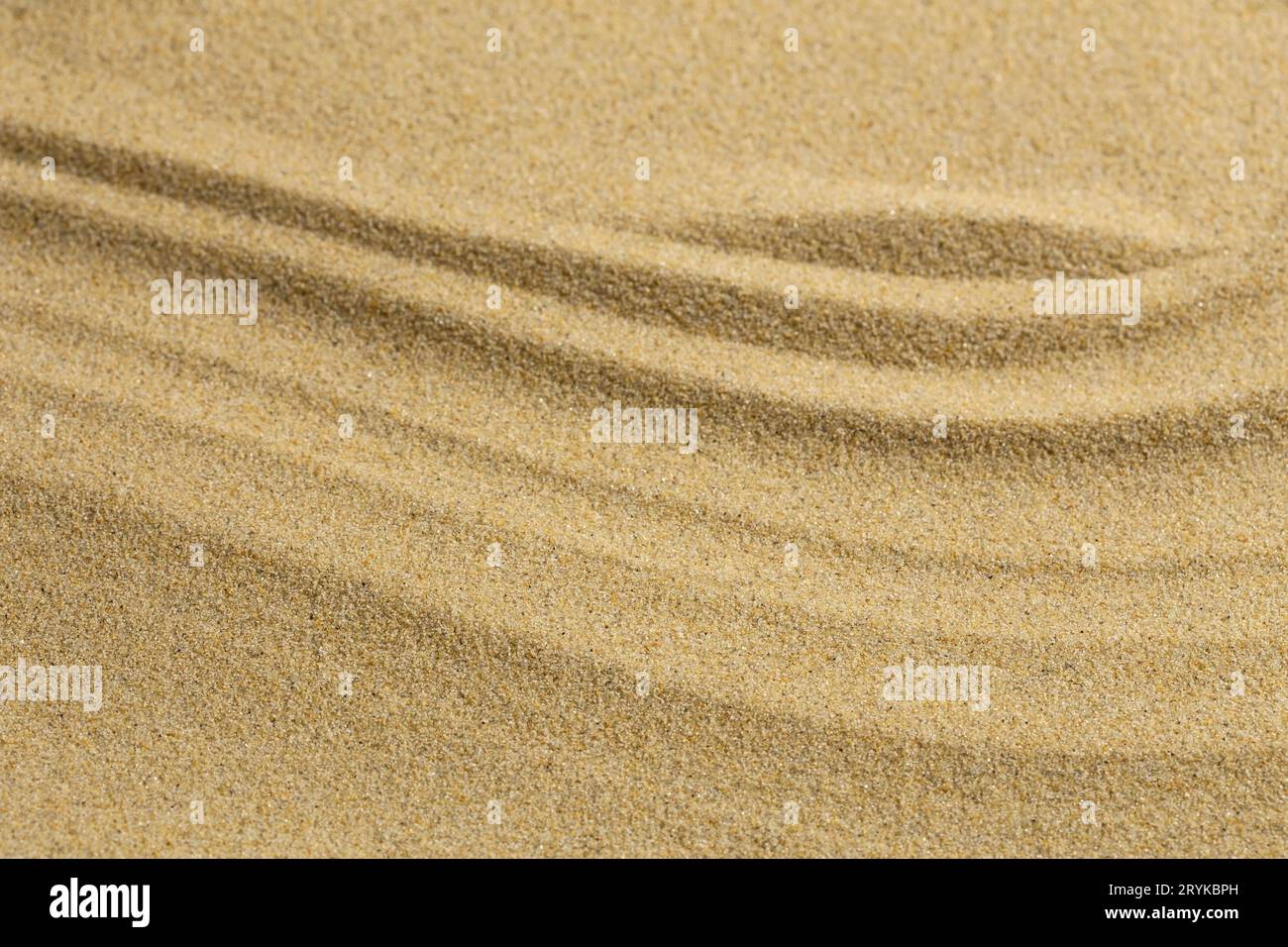 Zen-Muster im Sandhintergrund Stockfoto