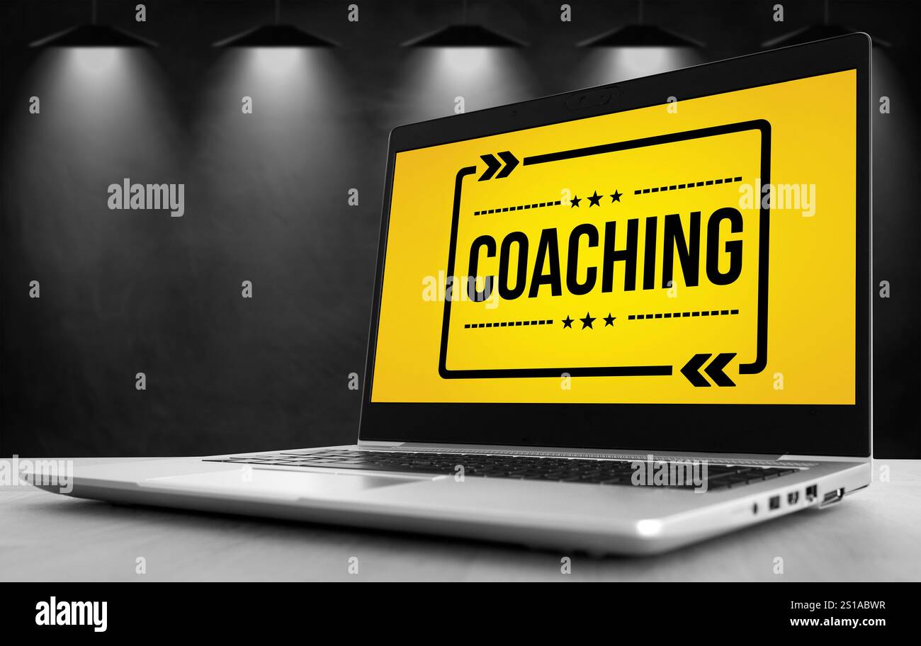 Coaching-Slogan auf dem Laptop Stockfoto
