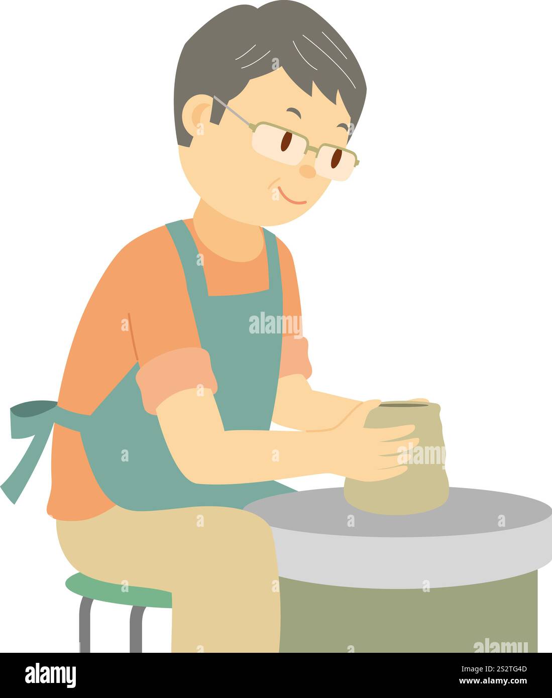 Ein Mann mittleren Alters, der seine Hand in der Töpferei versucht Stockfoto