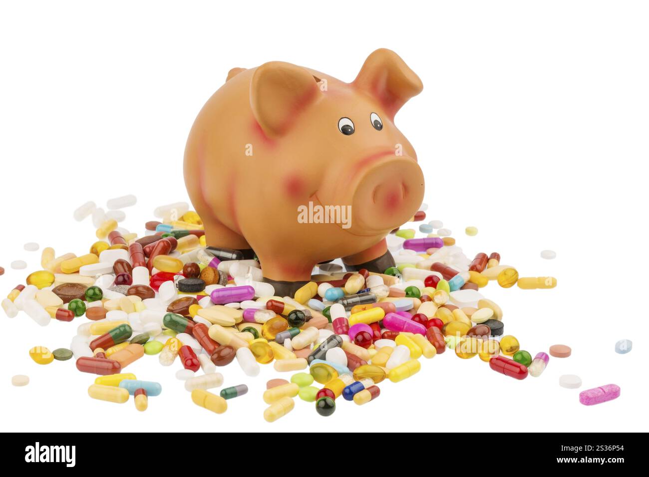 Tabletten, die neben einer Schweinebank liegen. Symbolisches Foto für Kosten in der Medizin- und Pharmaindustrie Österreich Stockfoto