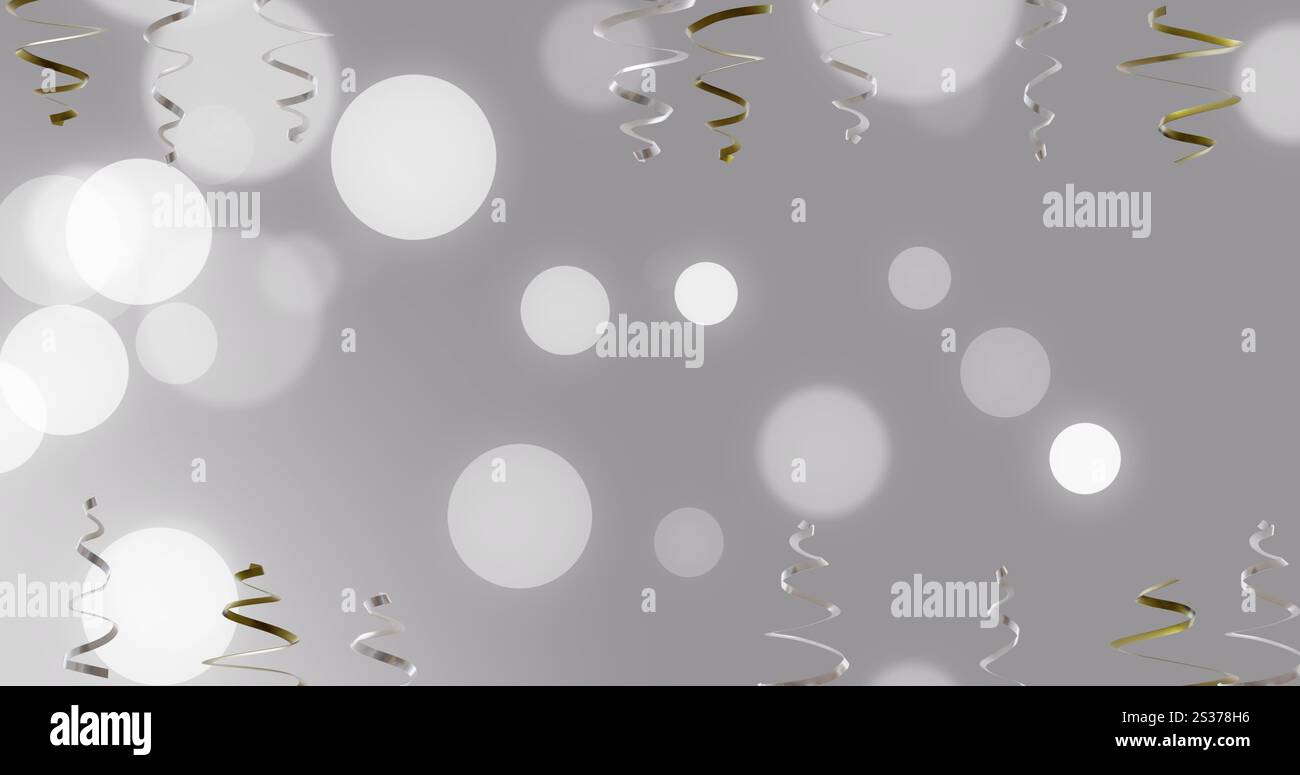 Bild von Party-Streamern und Lichtflecken auf grauem Hintergrund Stockfoto