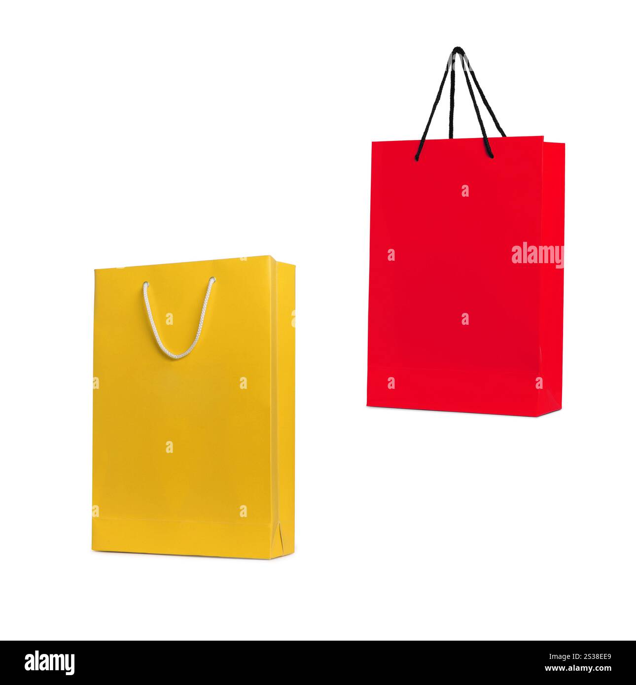 Rote und gelbe Einkaufstaschen isoliert. Rote und gelbe Einkaufstaschen Stockfoto