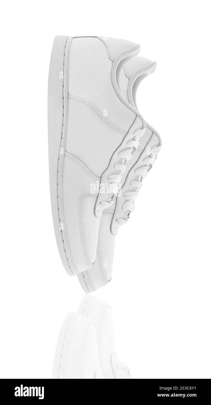 Paar Sportschuhe im Frauenstil isoliert auf weißem Hintergrund. Ein Paar Sportschuhe im Damenstil isoliert Stockfoto