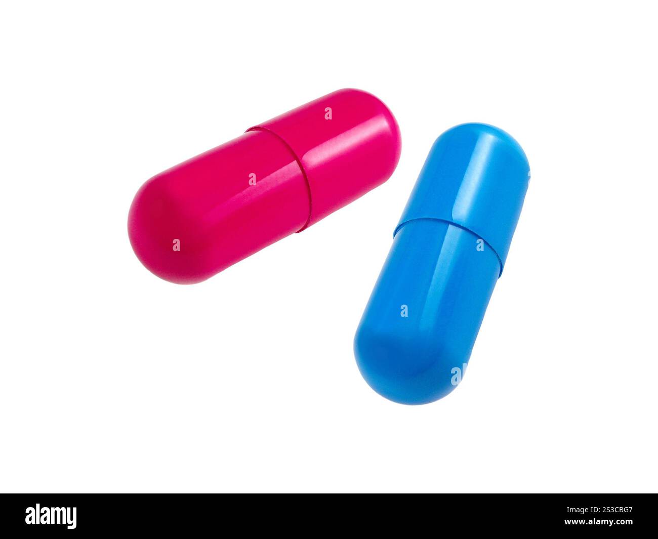 Rote und blaue Kapselpillen isoliert auf weiß. Violette und grüne Kapselpillen isoliert auf weiß Stockfoto