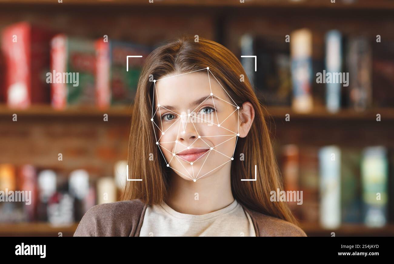 Die Gesichtserkennungstechnologie wurde am Gesicht einer jungen Frau in einer Bibliothek demonstriert Stockfoto