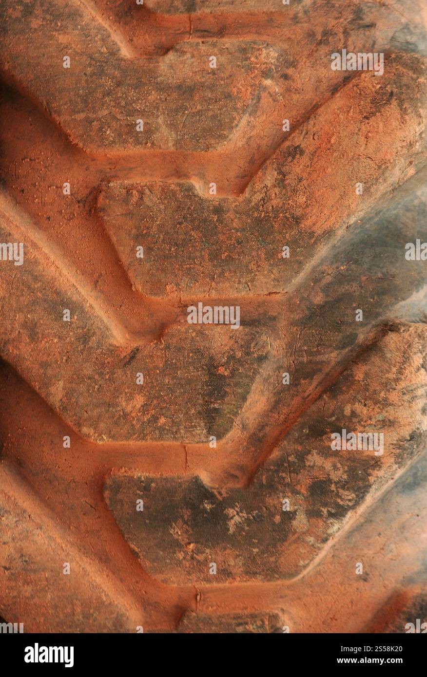 Großer Hauch von Traktorhintergrund oder Textur. Großer Schlepper Stockfoto