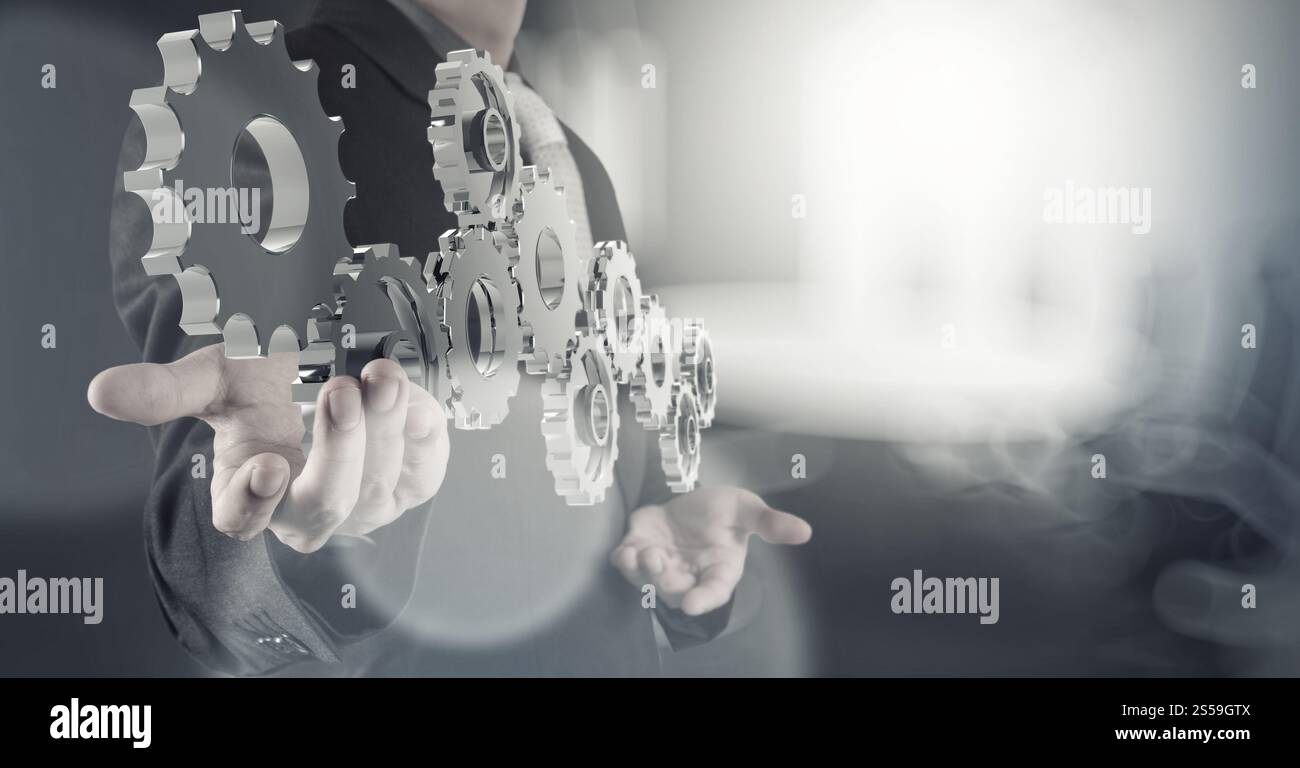 Geschäftsmann Hand zeigt 3d Zahnrad-Getriebe zum Erfolgskonzept Stockfoto