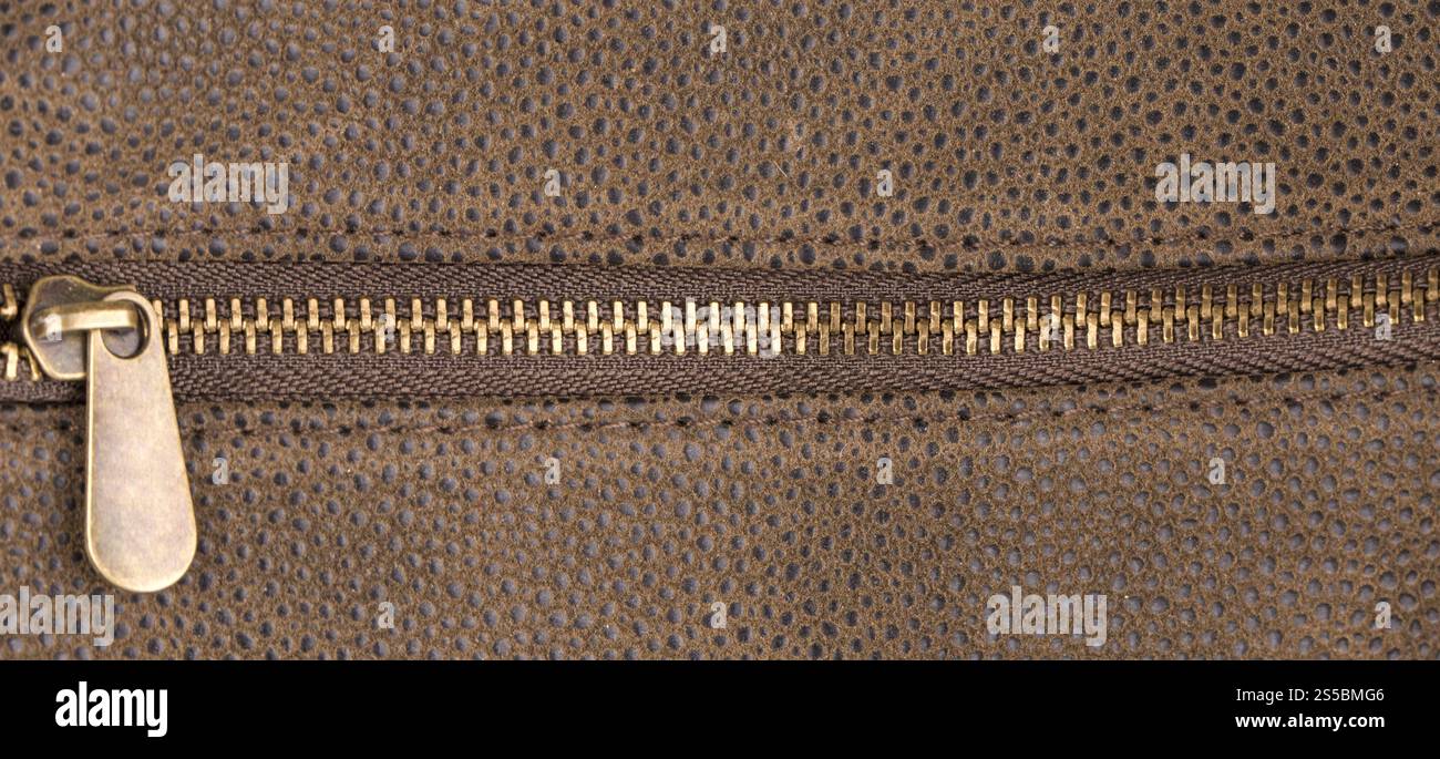 Braun Leder-Textur und Reißverschluss-Hintergrund Stockfoto