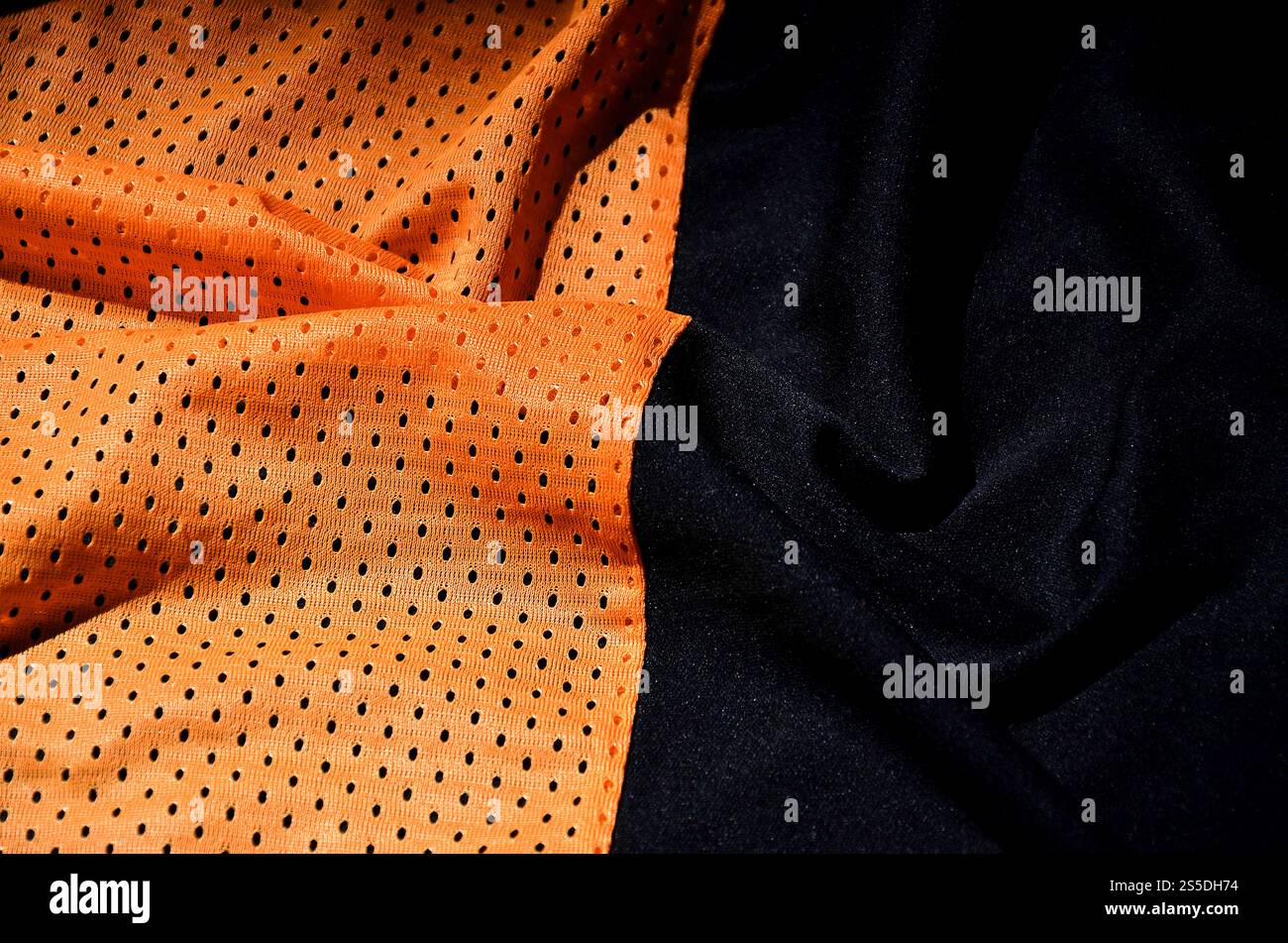 Sport Bekleidung Stoff Textur Hintergrund, Blick von oben auf die orange Tuch textile Oberfläche Stockfoto