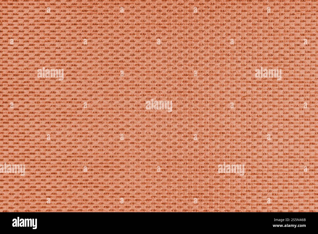Einfarbiger orangefarbener Jacquard-Polsterstoff, Satin-Material mit gewebter Struktur, Muster Textur Hintergrund. Nahaufnahme, Textiloberfläche aus Makrogewebe. Wallp Stockfoto
