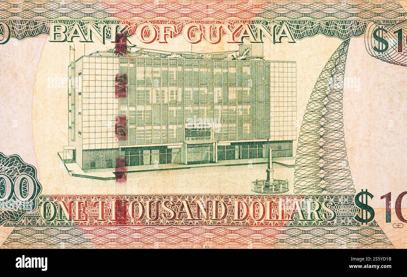 Ein Teil des braunen Guyana-1000-Dollar-Banknotenfragments aus nächster Nähe. Teil des braunen Guyana-1000-Dollar-Banknotenfragments Stockfoto