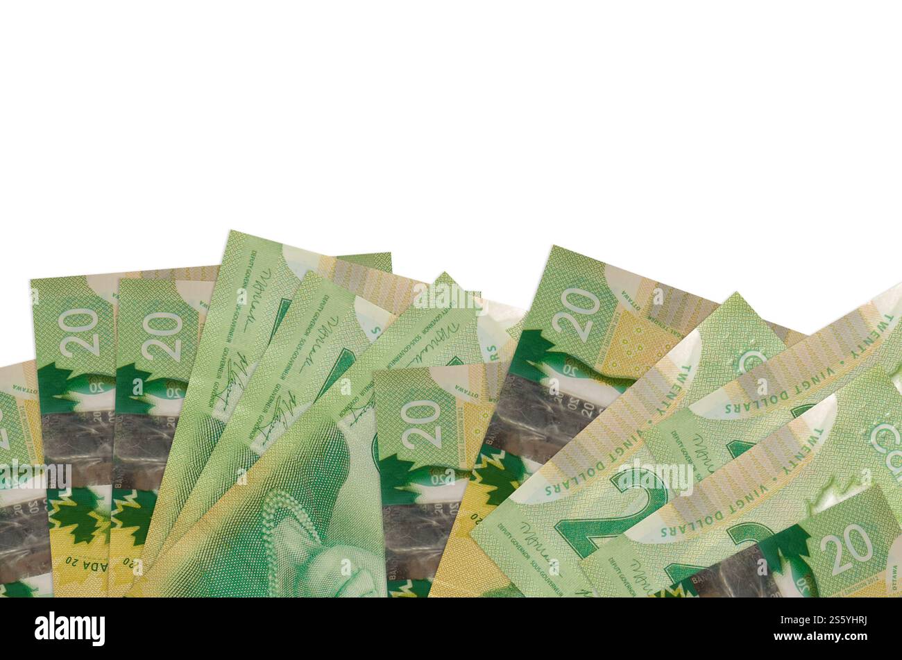 20 kanadische Dollar-Scheine liegen auf der Unterseite des Bildschirms isoliert auf weißem Hintergrund mit Kopierraum. Hintergrundbanner-Vorlage für Unternehmen Stockfoto