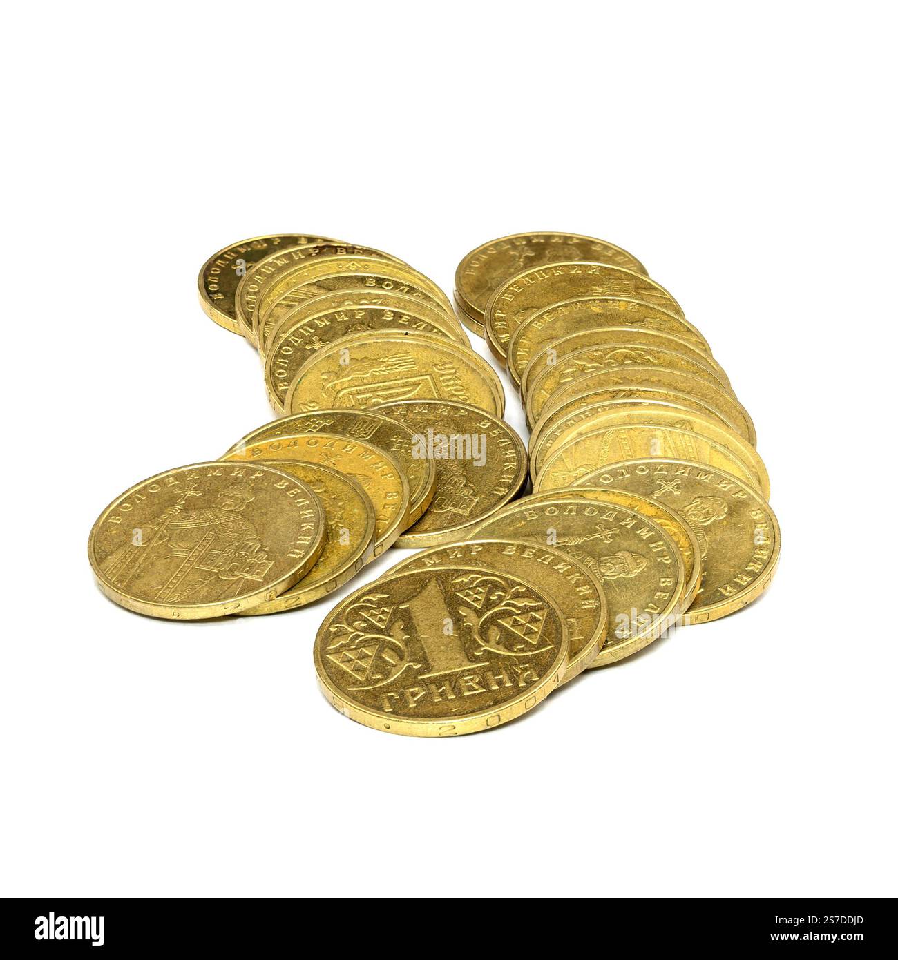 Eine Vielzahl von Gold-One-Hrywna-Münzen ist auf einer weißen Oberfläche verstreut. Die Münzen weisen einzigartige Designs und Stückelungen auf, die die Währung c widerspiegeln Stockfoto