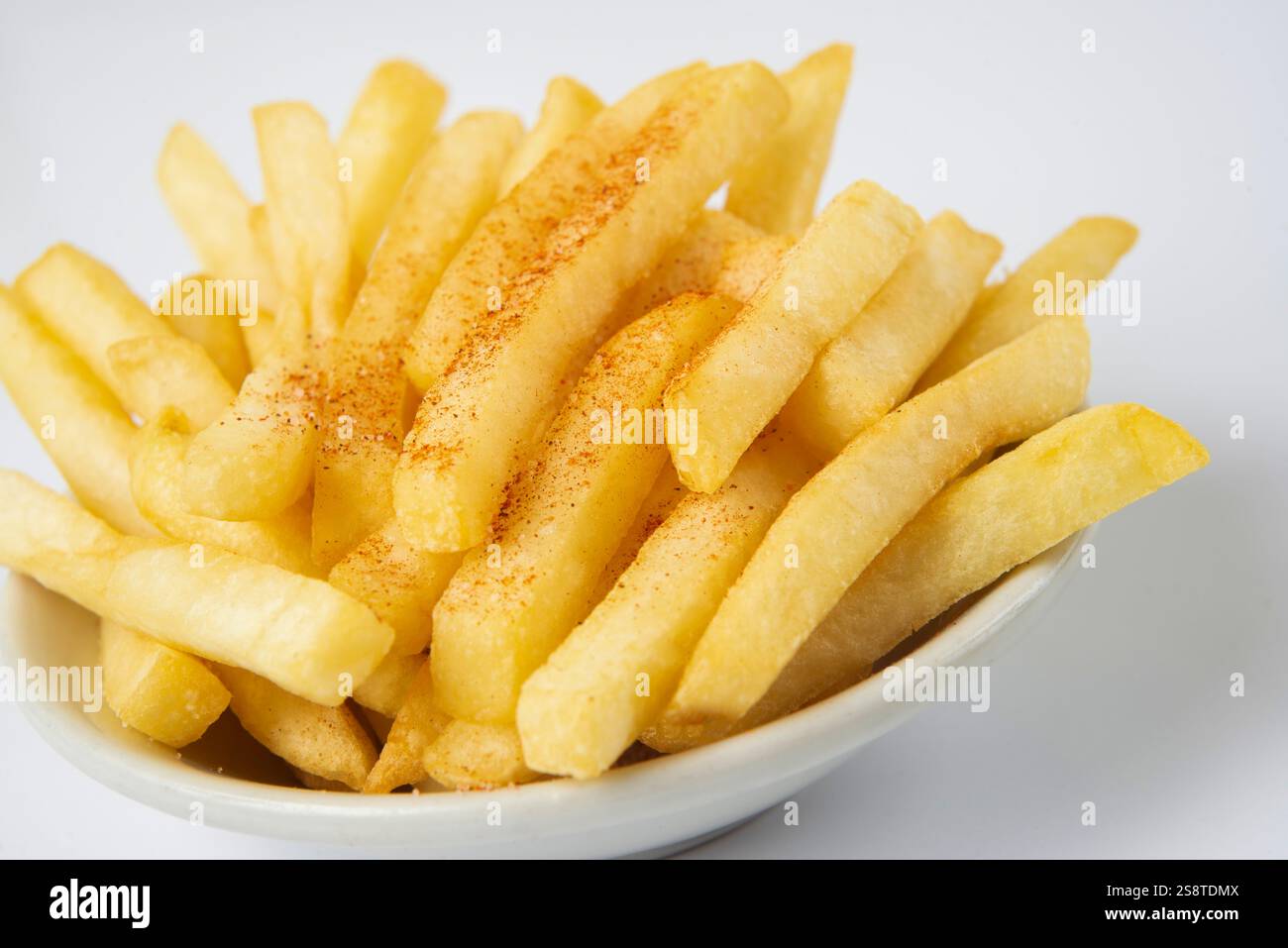Pommes frites mit Paprika Stockfoto