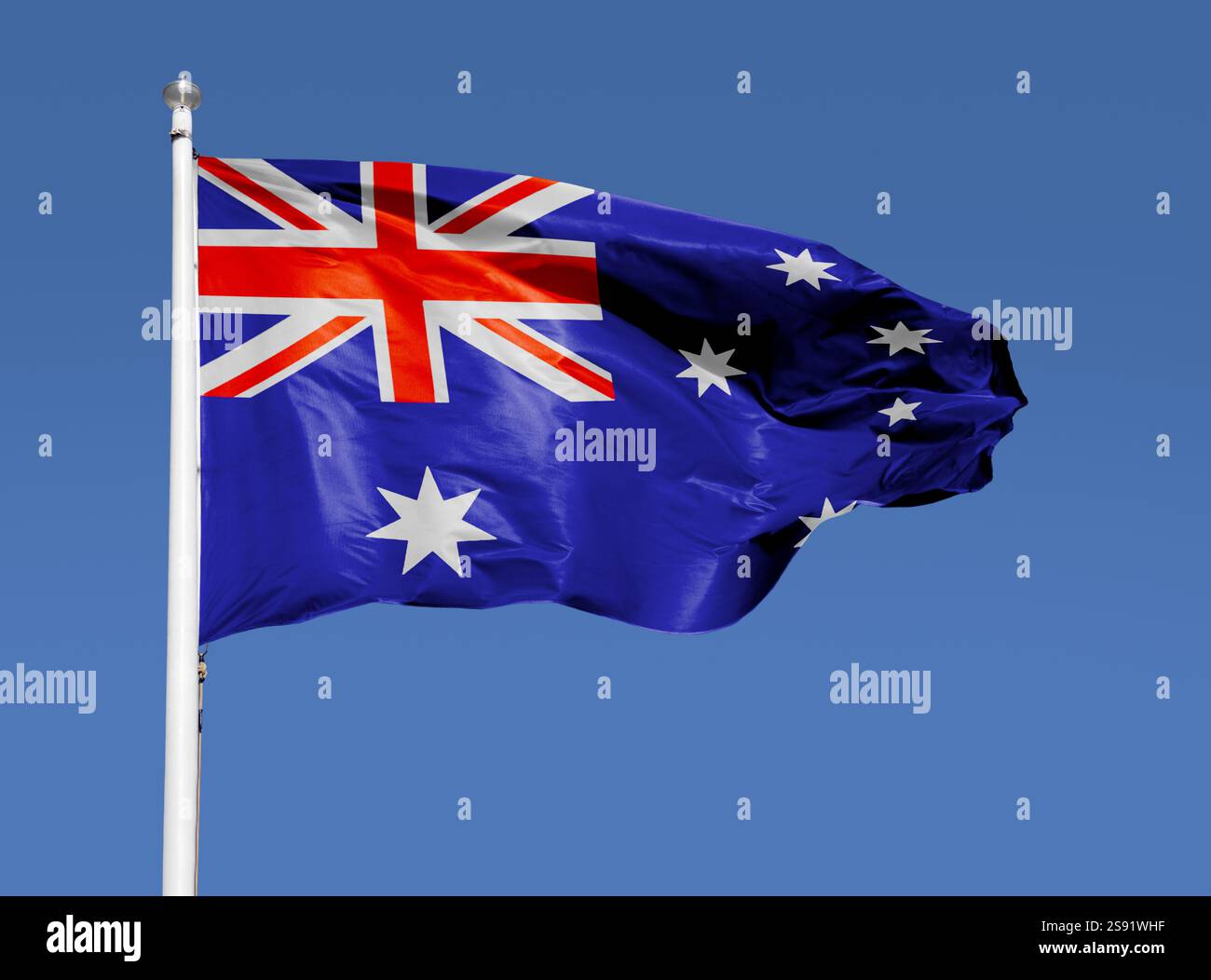 Australier von Amerika weht im Wind mit blauem Himmel Stockfoto