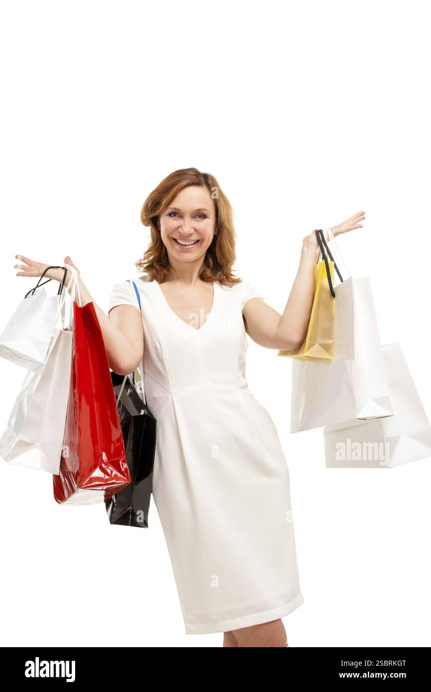 Schöne Frau mit einer Menge von Tragetaschen Stockfoto