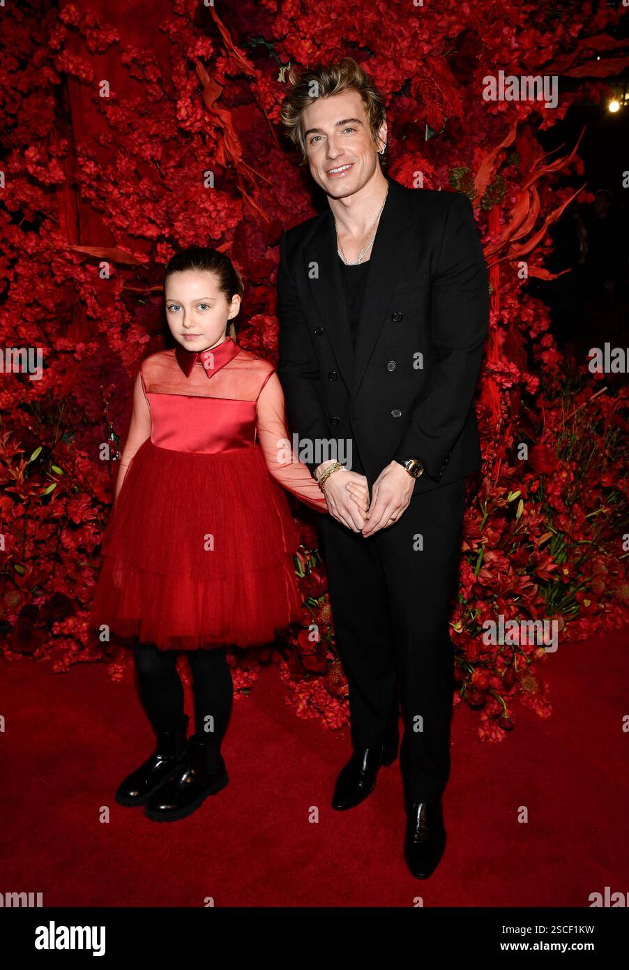 Jeremiah Brent, right, and daughter Poppy attend the Christian Siriano(00)