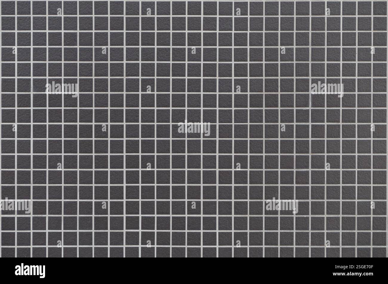 Schwarze Keramikziegelwand und Bodenfliesen Mosaikhintergrund Stockfoto