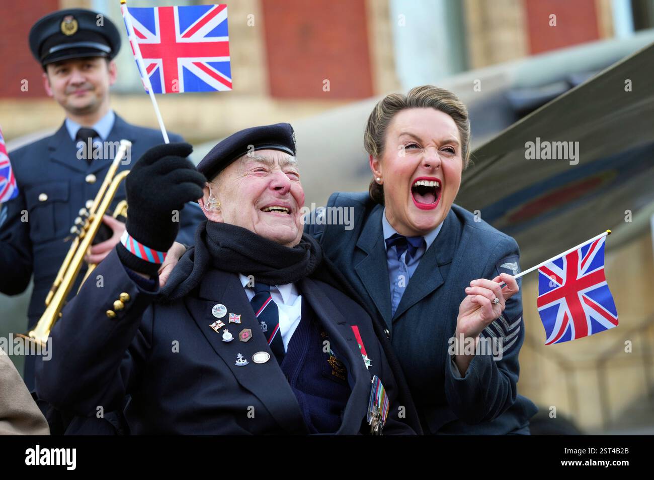 Henry Rice, a 98 year old Normandy Vet, gets a hug from Katie Ashby ...