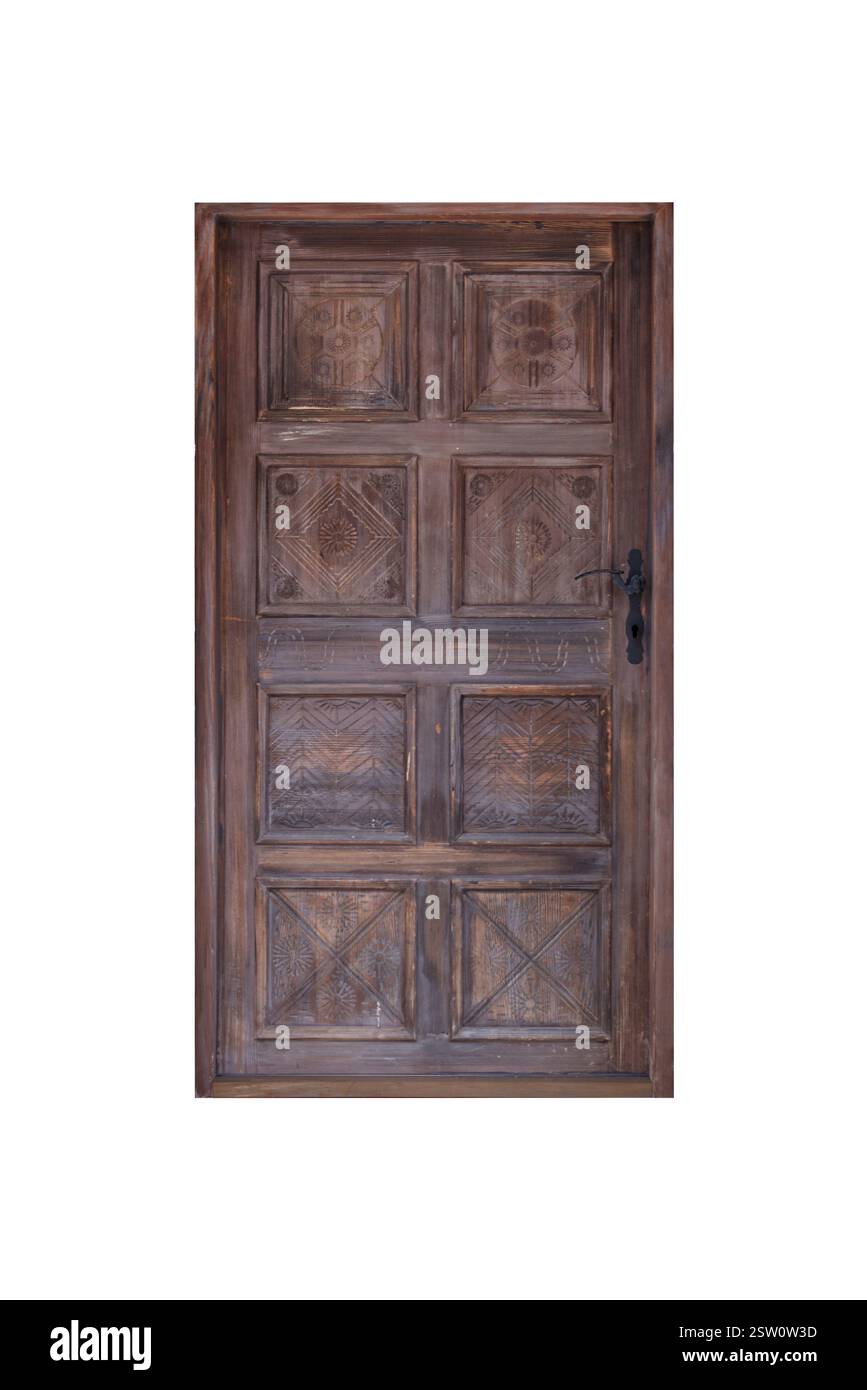 Massive Holztüren mit komplizierten Schnitzereien und Blumenmotiven, einst Teil eines alten Stadtgebäudes, zeigen historische Handwerkskunst und Eleganz Stockfoto