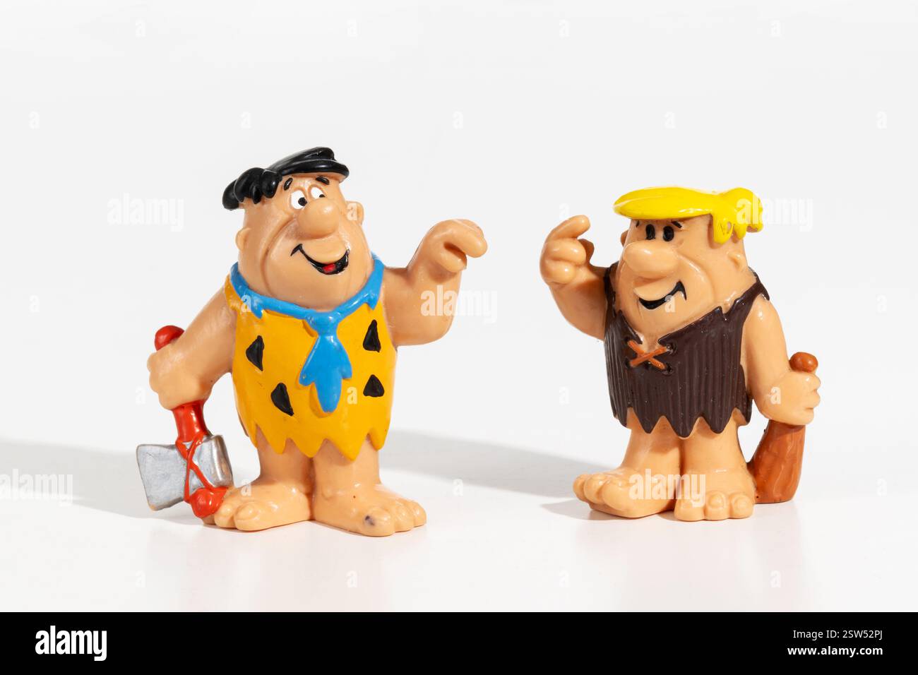 Die Figuren Fred Flintstone und Barney kommunizieren mit Gesten Stockfoto