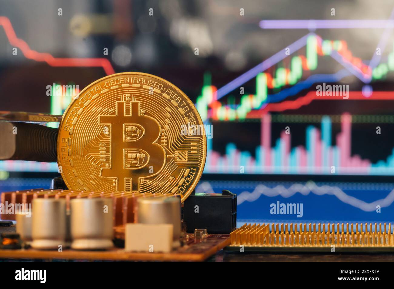 Bitcoin-Nahaufnahme elektronischer Bauteile, vor dem Hintergrund von Farbgrafiken Stockfoto