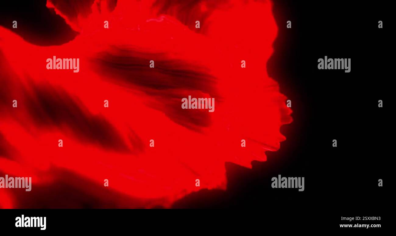 Bild von roten Formen, die sich auf schwarzem Hintergrund bewegen Stockfoto