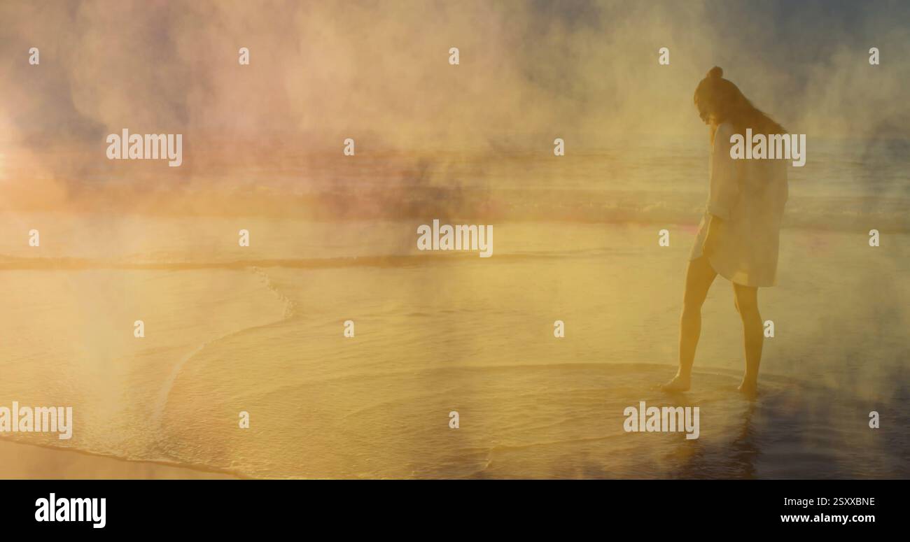 Bild von Rauchpfaden über der kaukasischen Frau am Strand Stockfoto
