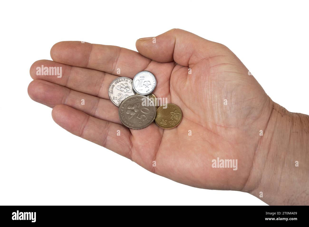 Einige malaysische Ringgit Münzen in der Hand Stockfoto