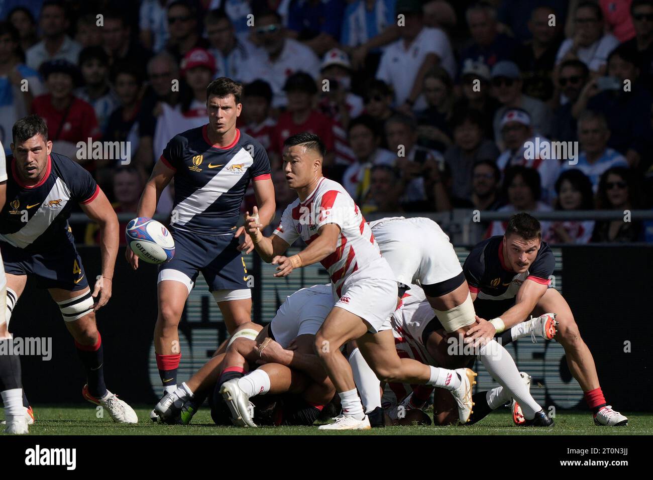 Japan's Naoto Saito pases the ball during the Rugby World Cup Pool D