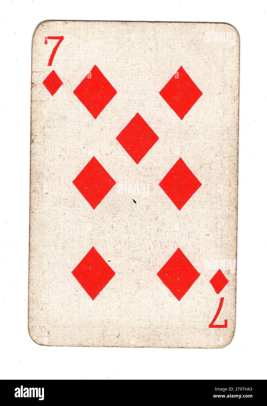 Eine Vintage-7-Diamanten-Spielkarte isoliert auf weißem Hintergrund. Stockfoto