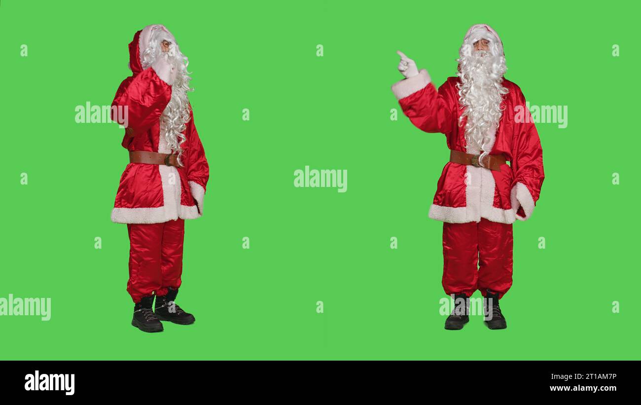 Saint-Nick-Charakter, der Ablehnung und Ablehnung ausdrückt und kein Symbol auf der Kamera zeigt. Der Weihnachtsmann fühlt sich unzufrieden und enttäuscht, er hat Uneinigkeit und Enttäuschung auf dem Greenscreen unterzeichnet. Stockfoto