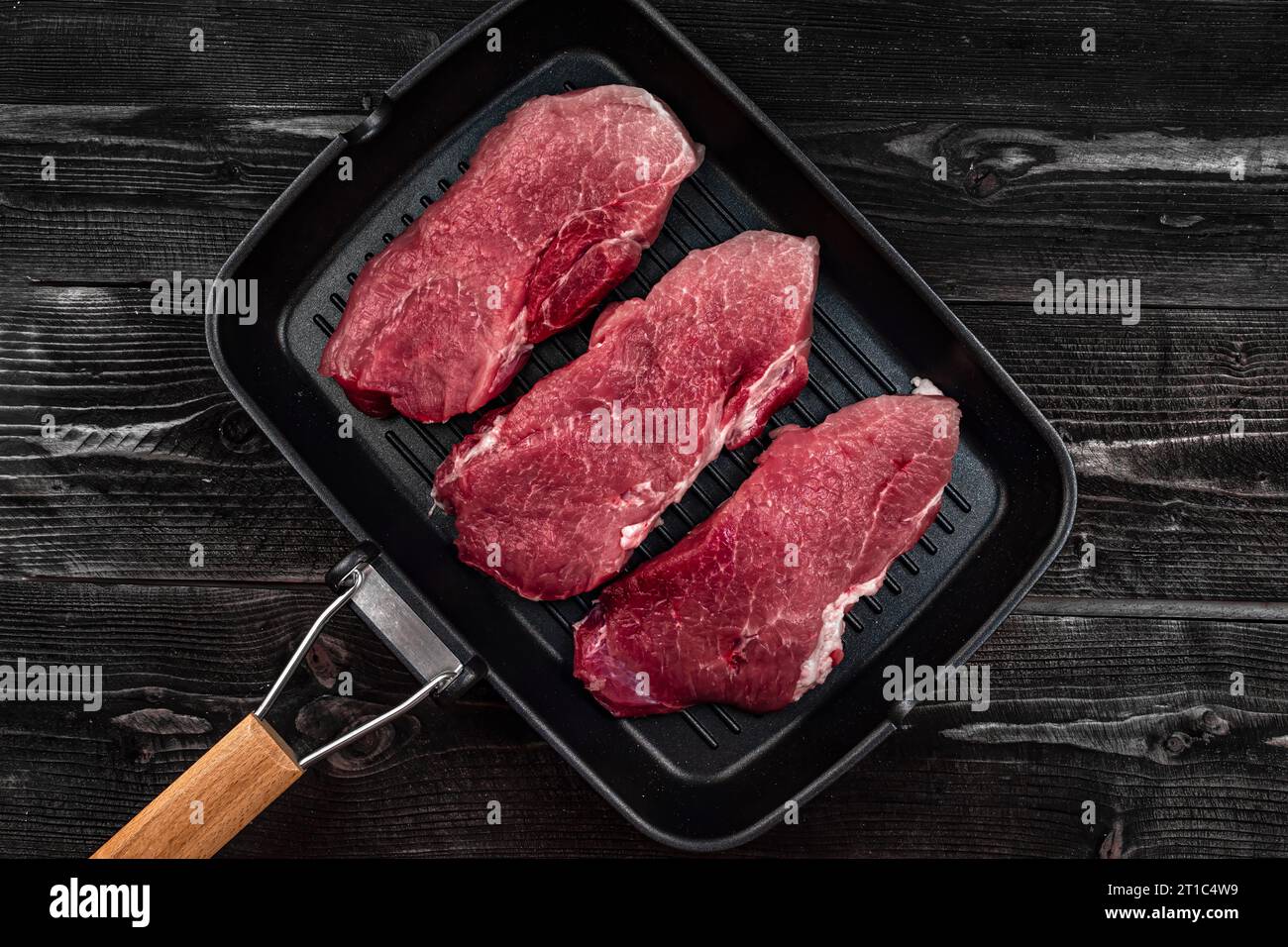 Drei saftige Stücke Fleisch - Grill Kochen Steak in Eine Pfanne Stockfoto