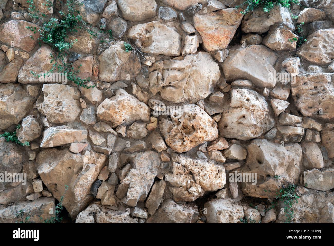 Antike Mauer aus Steinen Textur Stockfoto