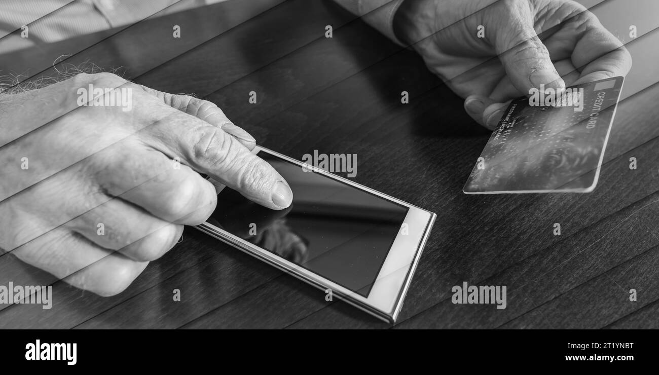 Mann Hände mit Smartphone und Kreditkarte für Online-Zahlung, geometrisches Muster Stockfoto