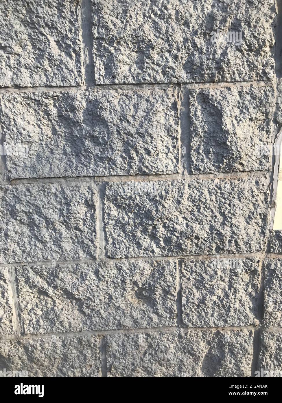 Hintergrund einer Steinbedeckung einer Mauer Stockfoto