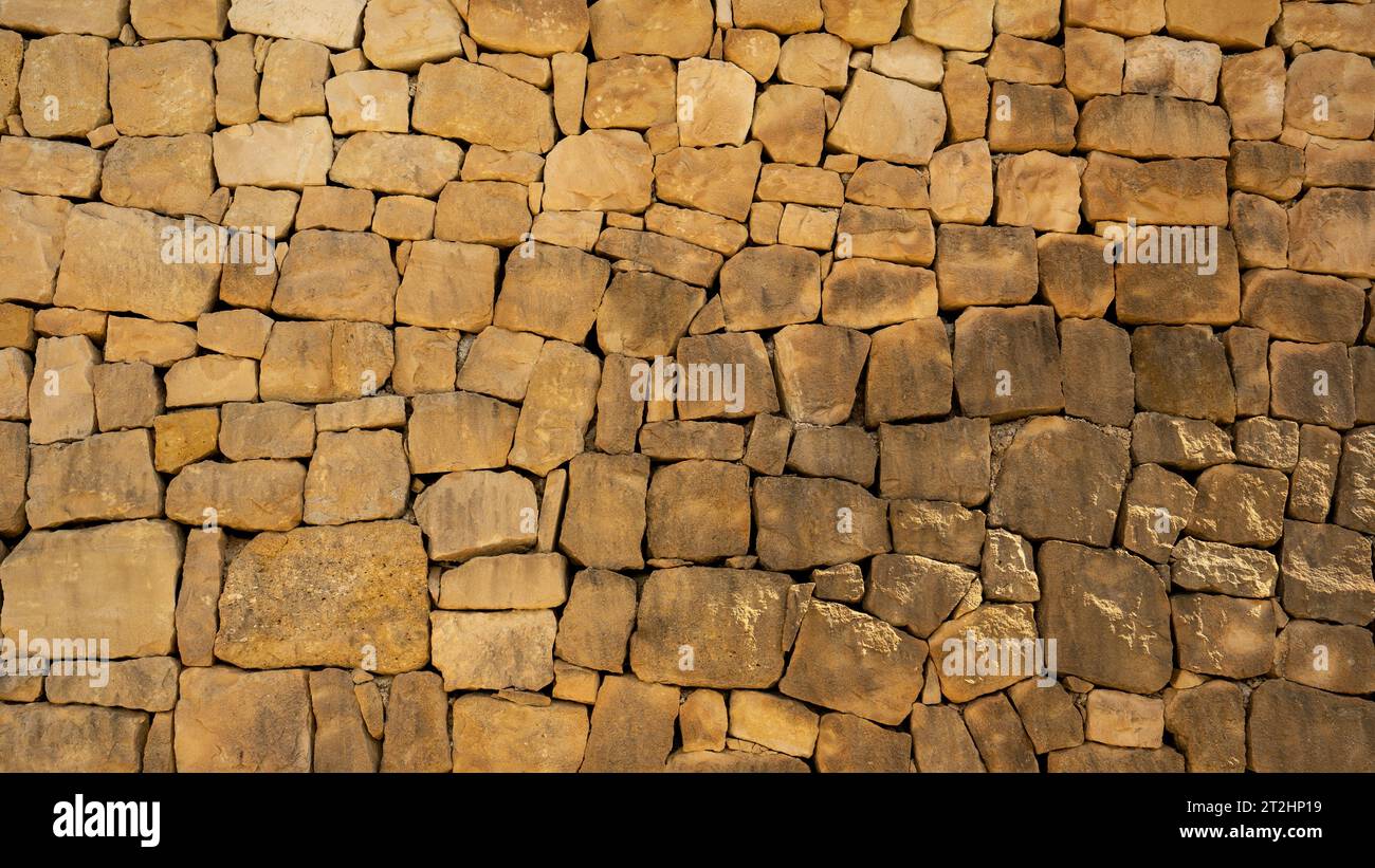 Natursteinmauer. Hintergrund. Wallpape Stockfoto