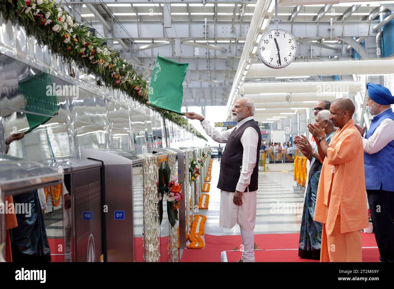 This handout photo provided by the Prime Minister's Office shows Prime Minister Narendra Modi flag off the 'Namo Bharat' train on the outskirts of New Delhi, India, Friday, Oct. 20, 2023. (Prime Minister's Office via AP) Stockfoto