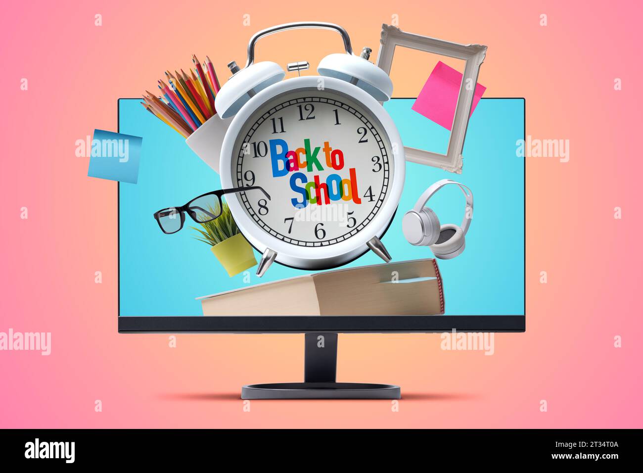 Back-to-School-Konzept: Schulbedarf und Wecker aus einem Computerbildschirm Stockfoto