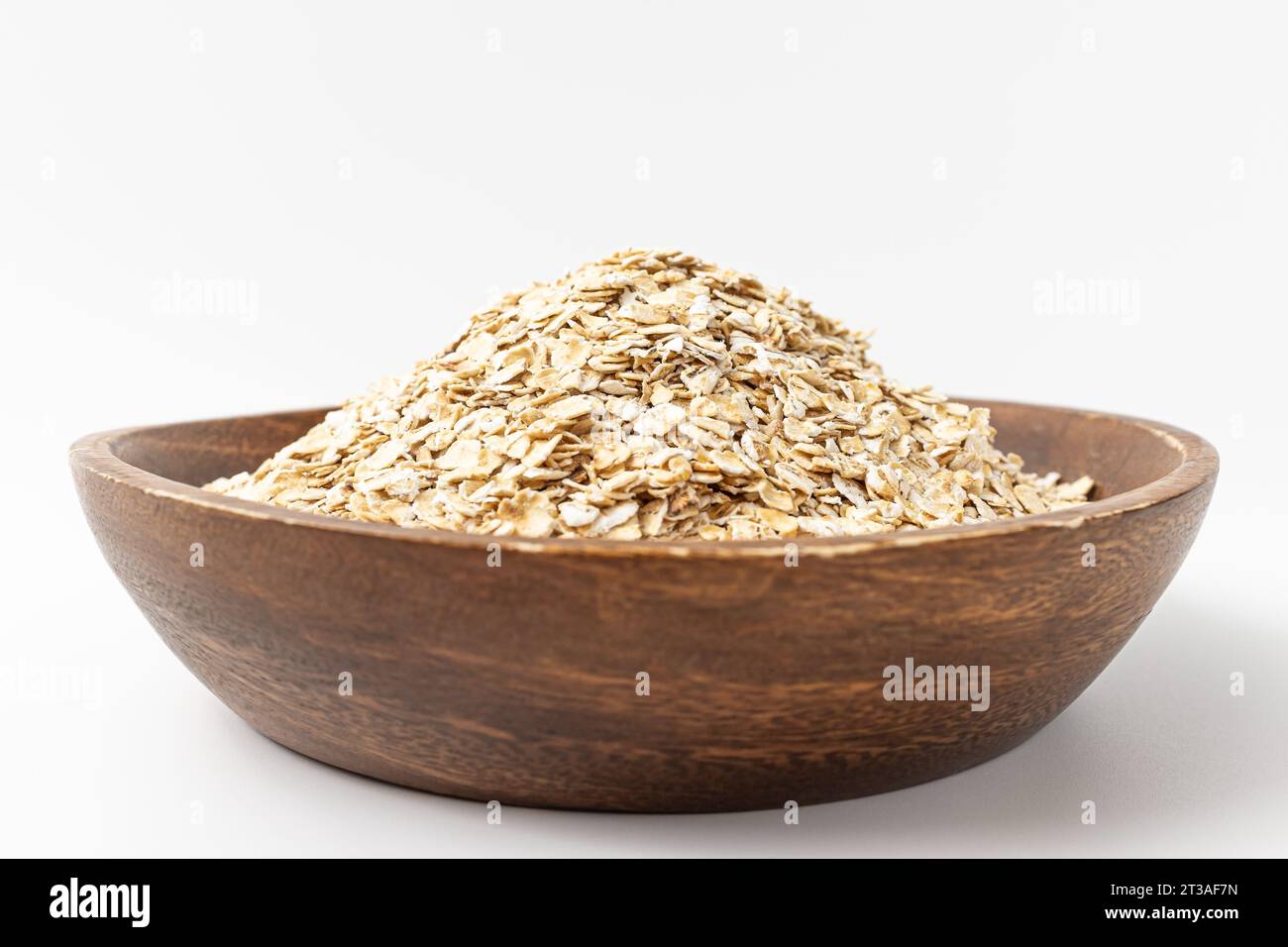 Haferflocken auf weißem Hintergrund Stockfoto