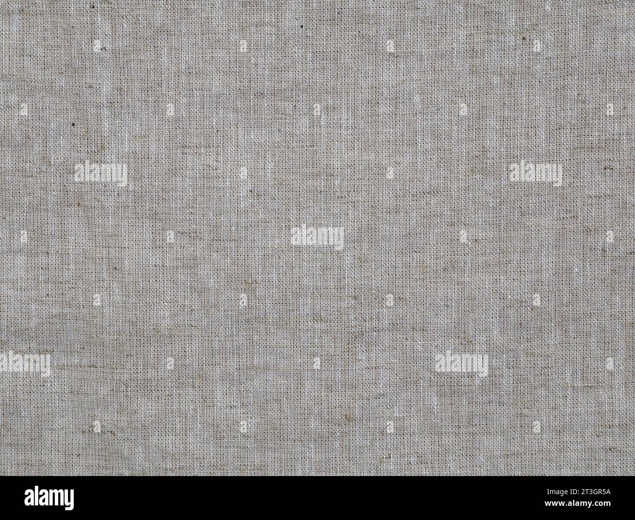 Das Strukturdetail des gewebten Leinenstoff wird in einer Nahansicht gezeigt. Stockfoto