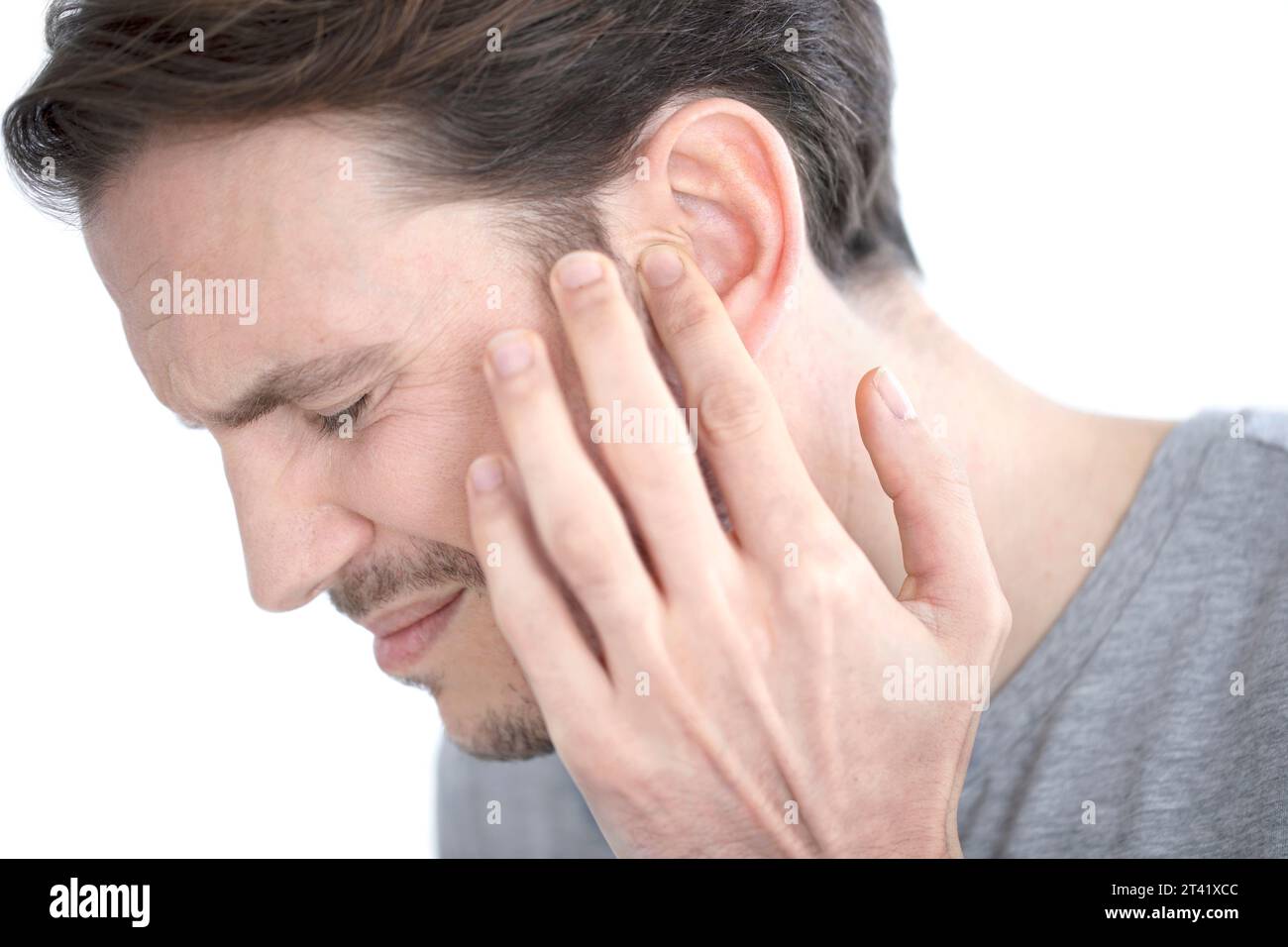 Mann mit Ohrenschmerzen Stockfoto